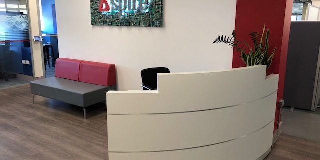 Modern reception desk and soft seating
